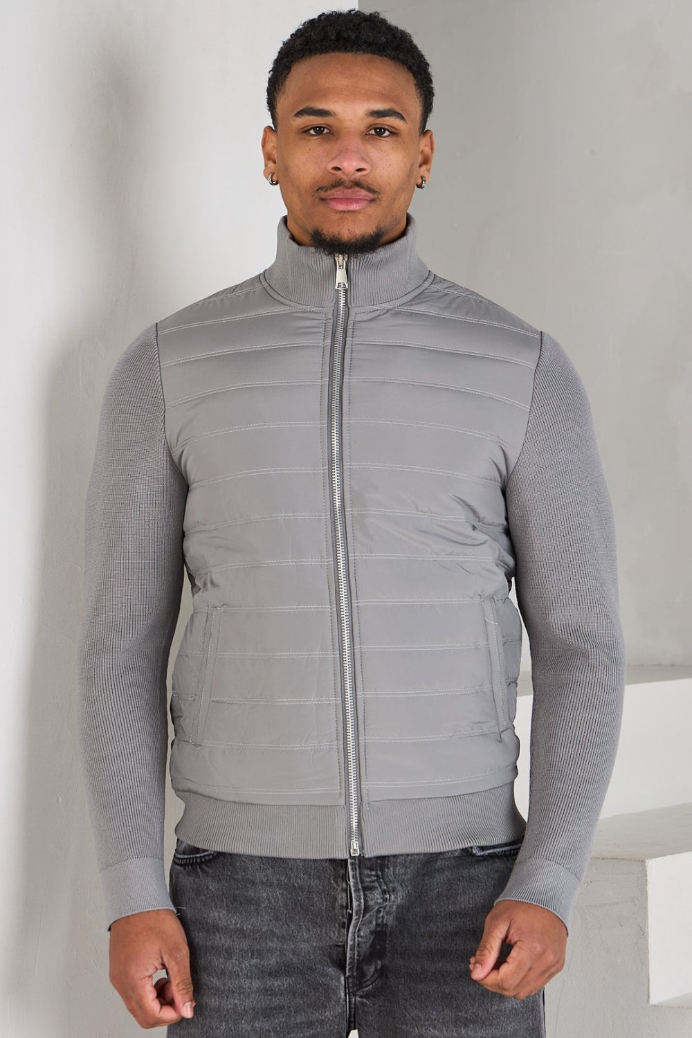 Dark grey quilted jacket with knit panel