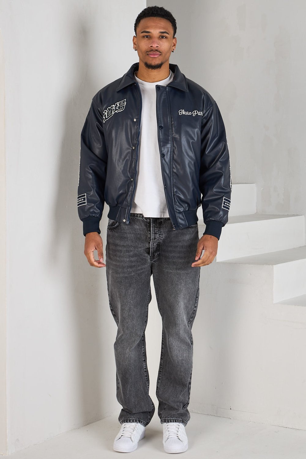 Black bomber jacket with white lettering