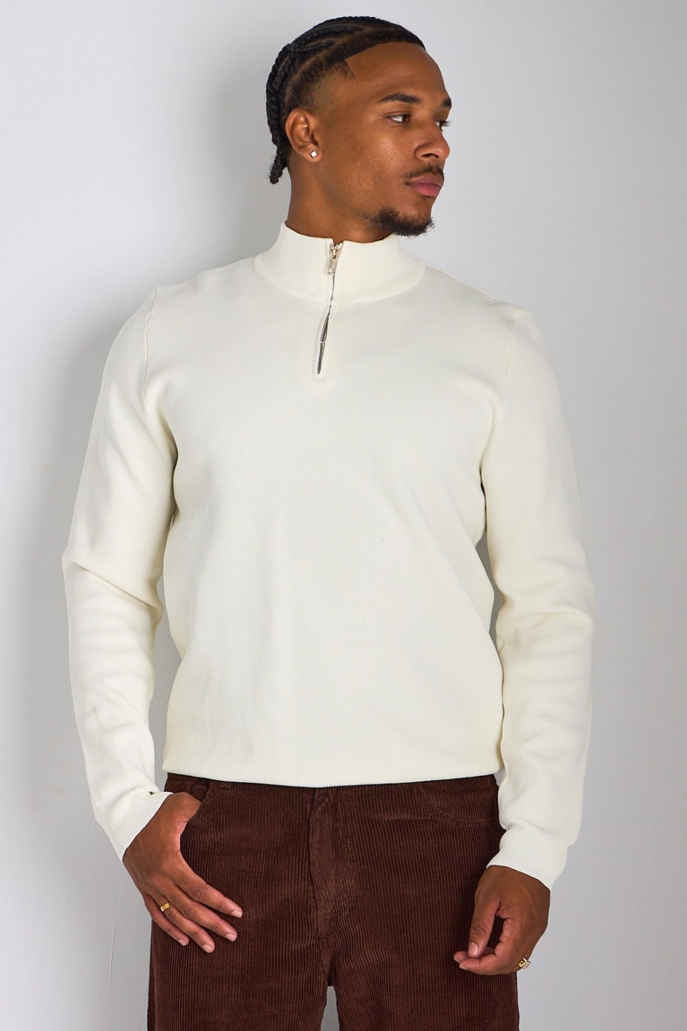 White half-zip knit top with high collar