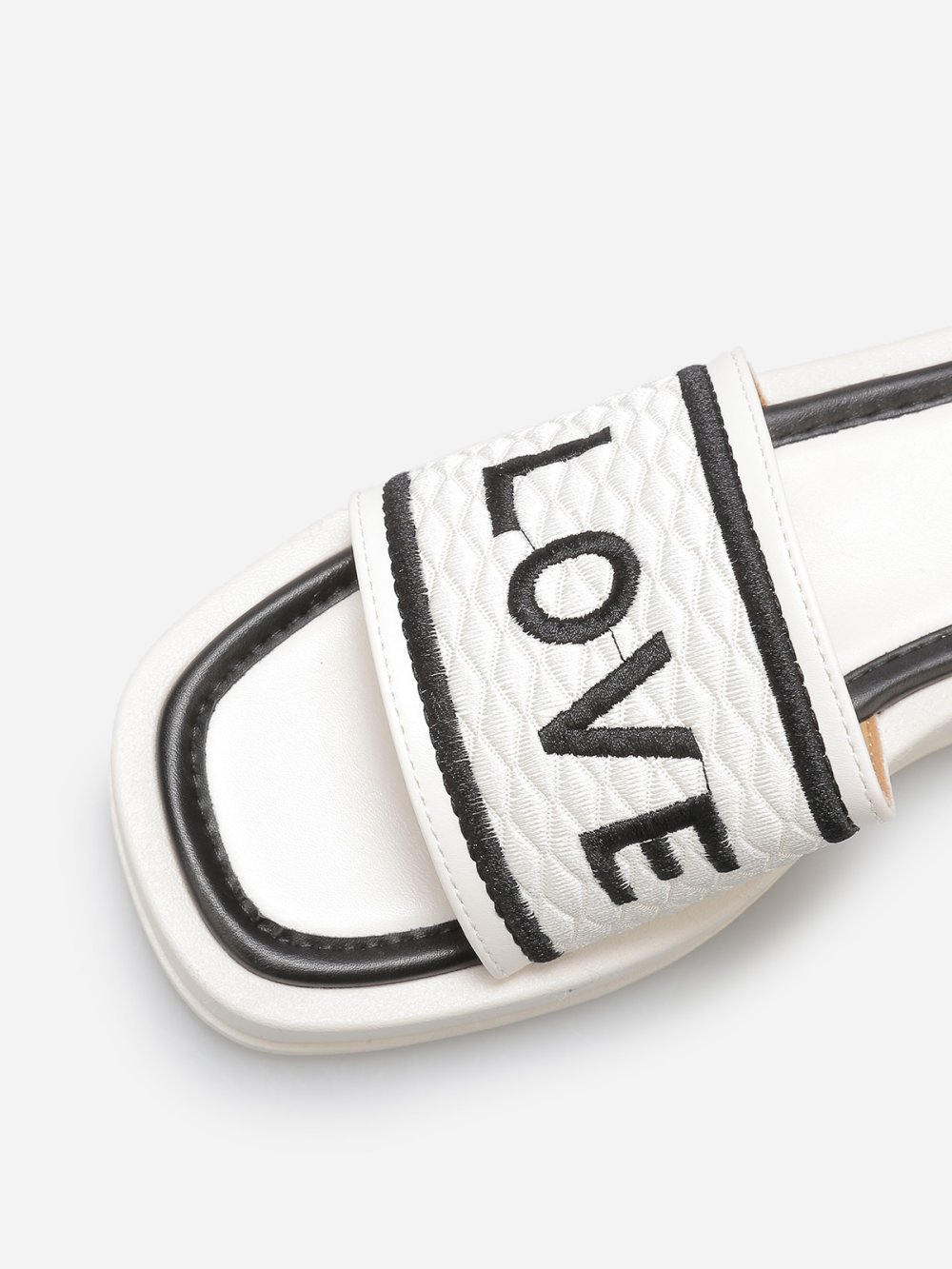 White platform mules with quilted strap