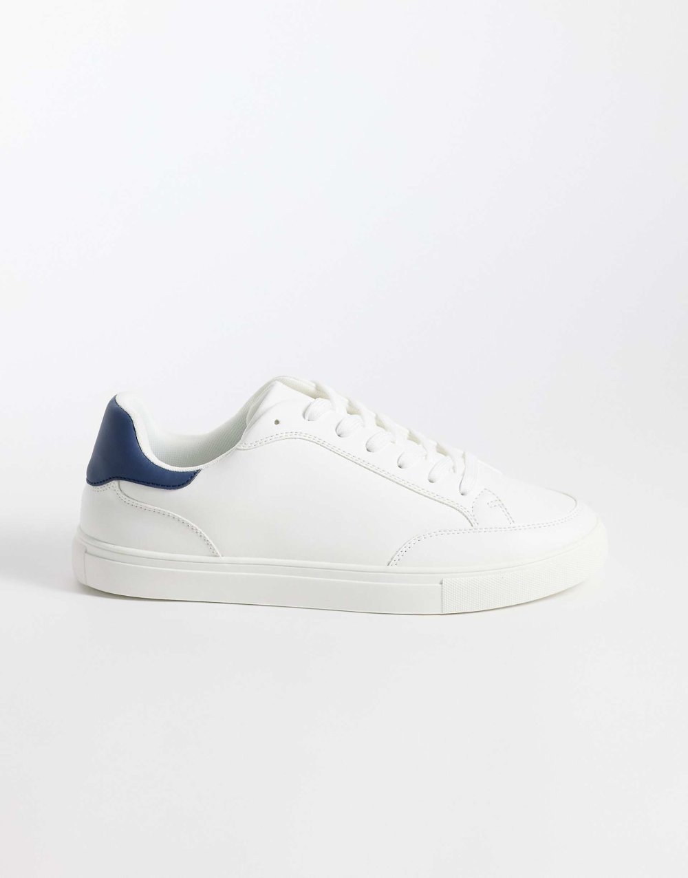White lace-up trainers with navy heel tab