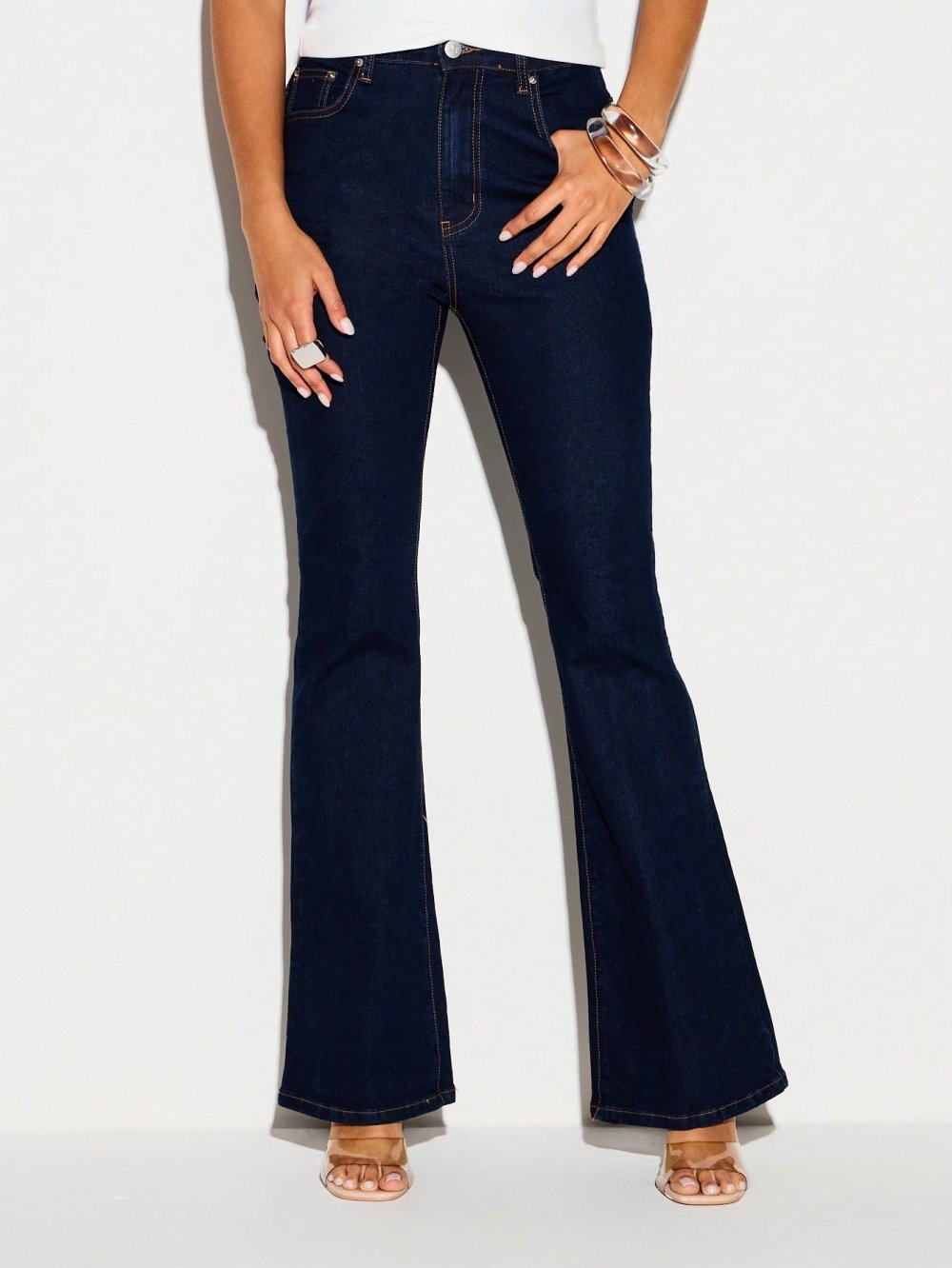 High-waisted flared jeans with split hem