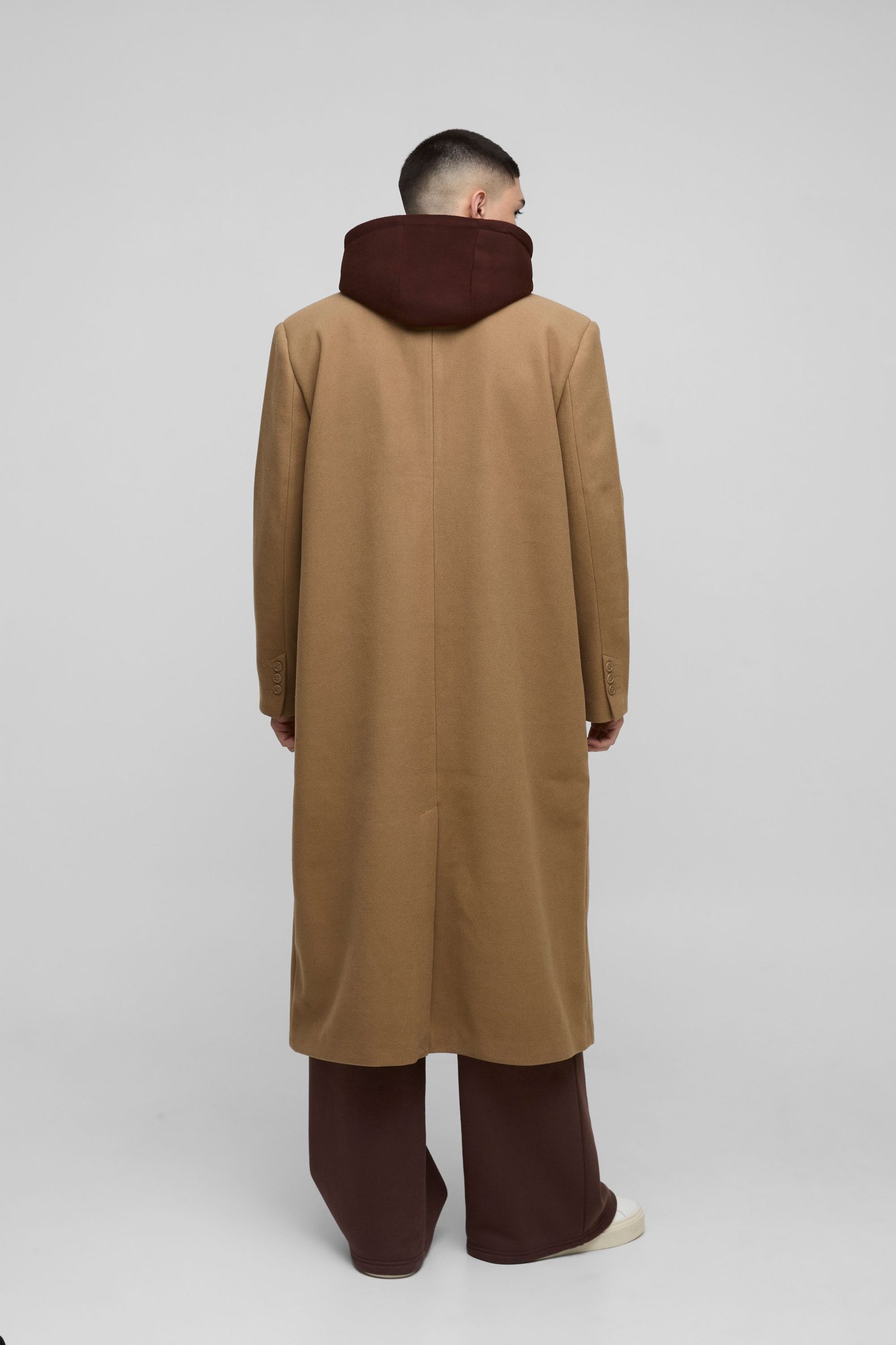 Oversized overcoat with faux hooded jersey layer in tan