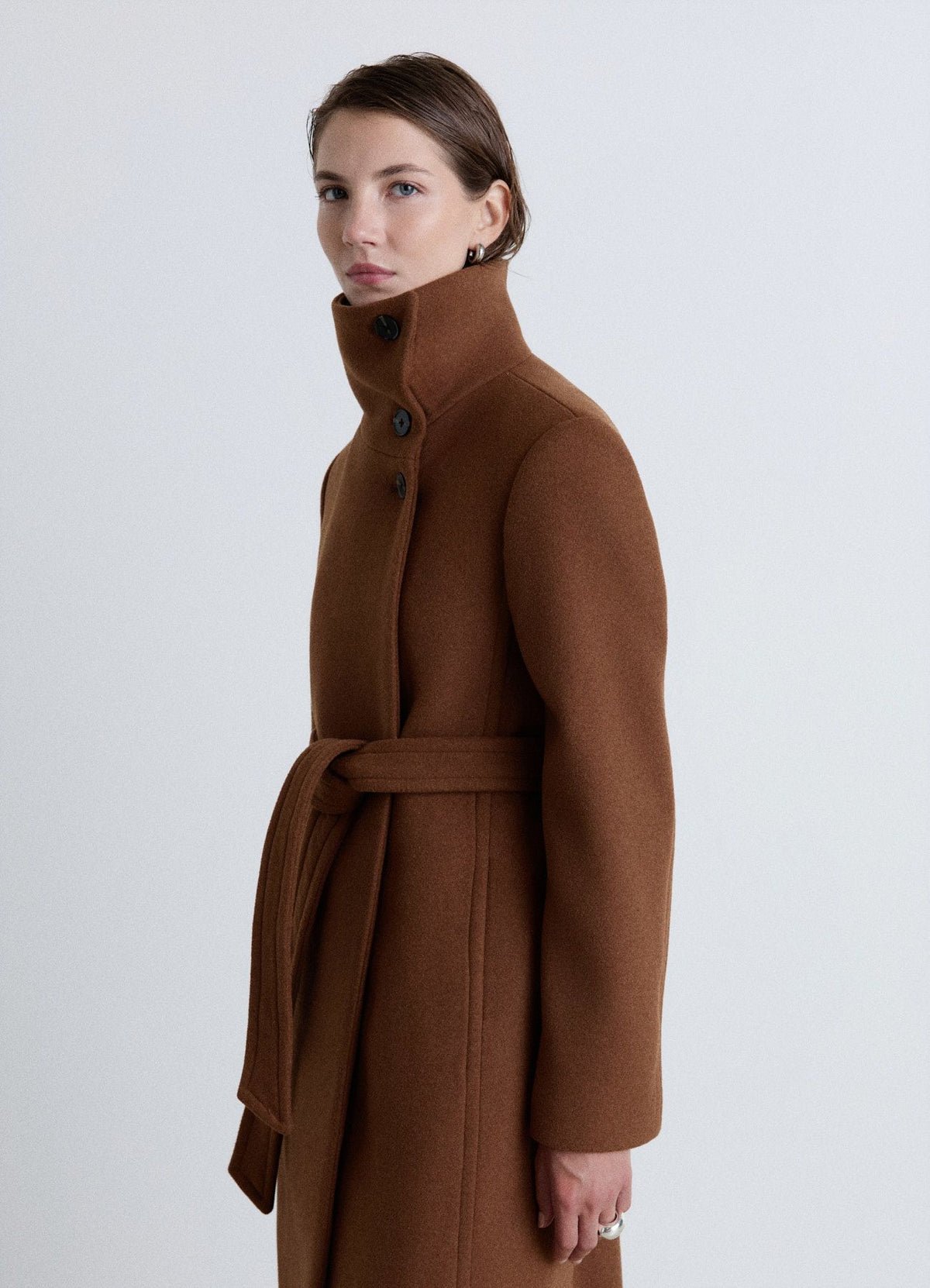 Long high-neck belted coat