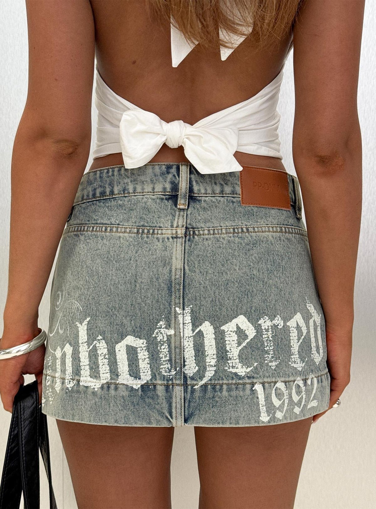 Graphic denim mini skirt