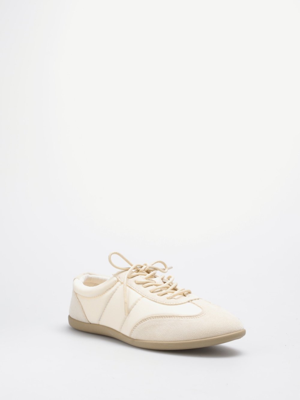 Beige quilted and faux suede trainers