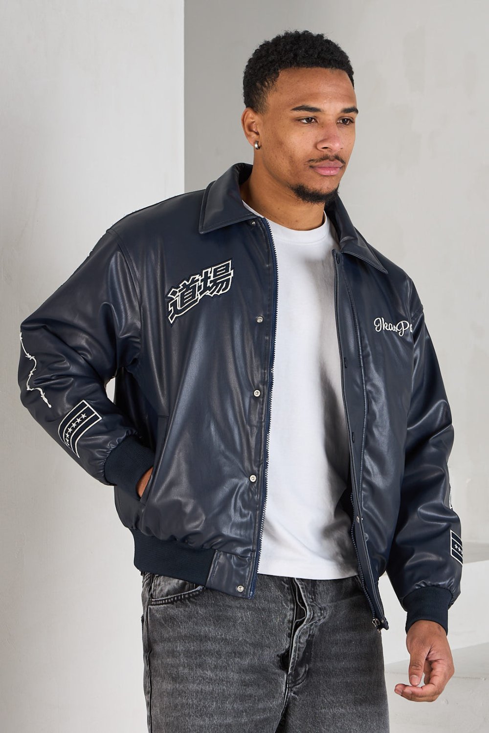 Black bomber jacket with white lettering