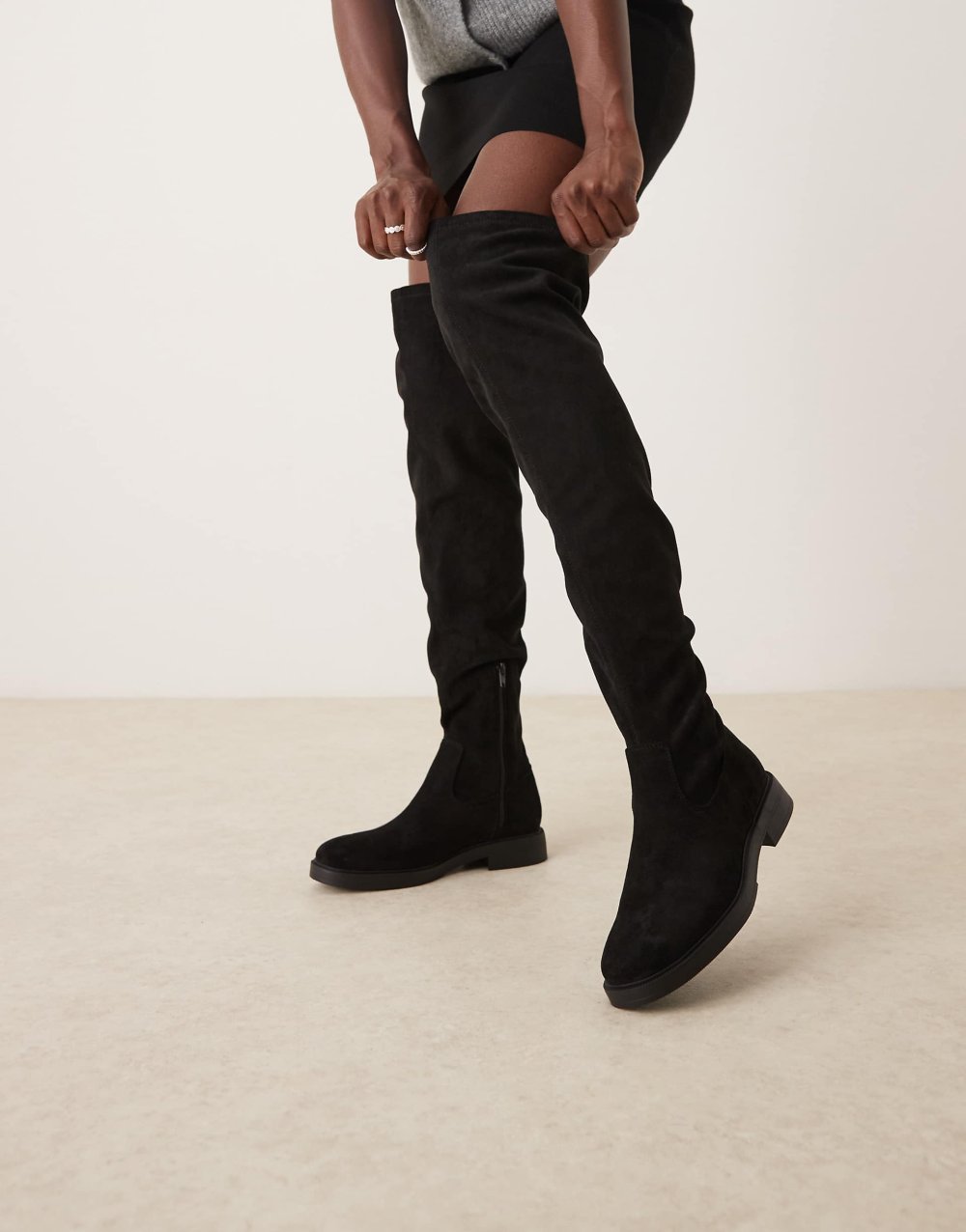 Flat faux suede thigh high boots in black