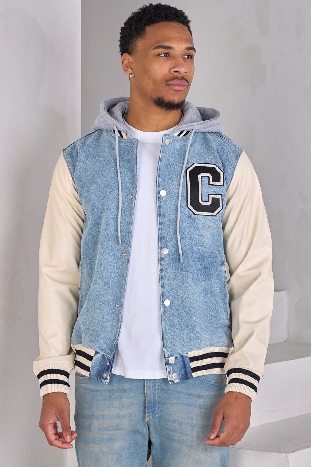 Blue denim jacket with faux leather sleeves