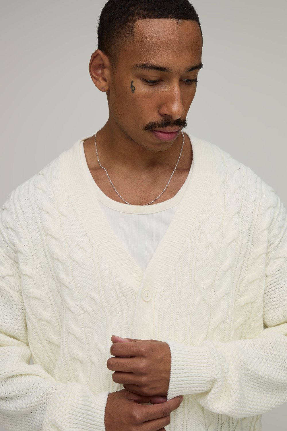 Ecru cable-knit V-neck cardigan