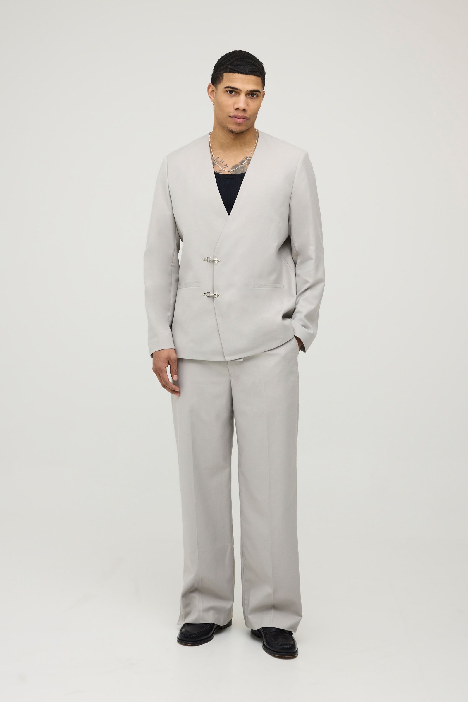 Collarless oversized blazer with fireman clasp