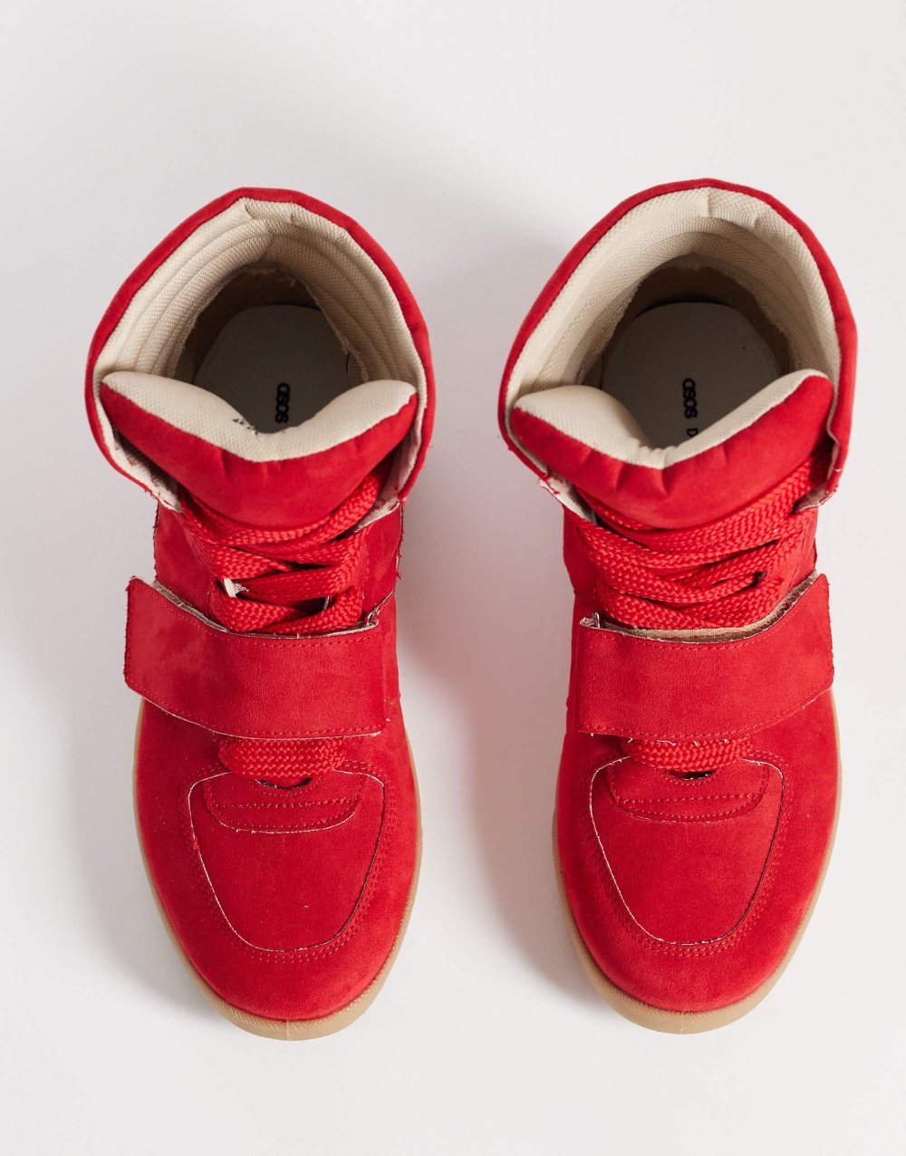 Hidden wedge faux suede trainers in red