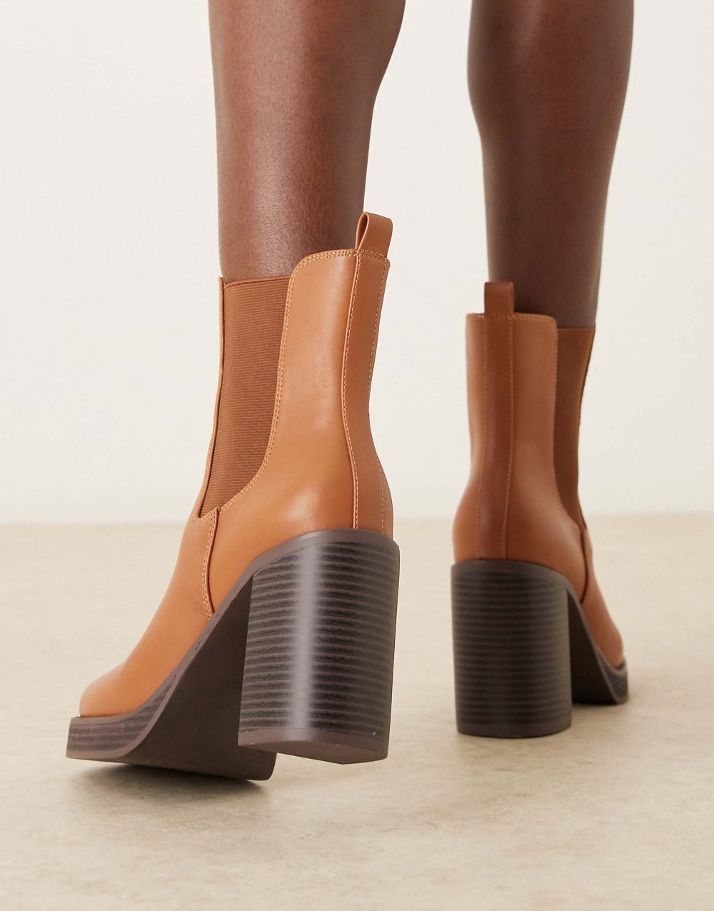 Platform heeled ankle boots in tan