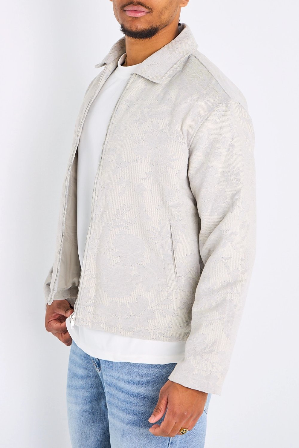 Light grey zip-up jacket with floral print