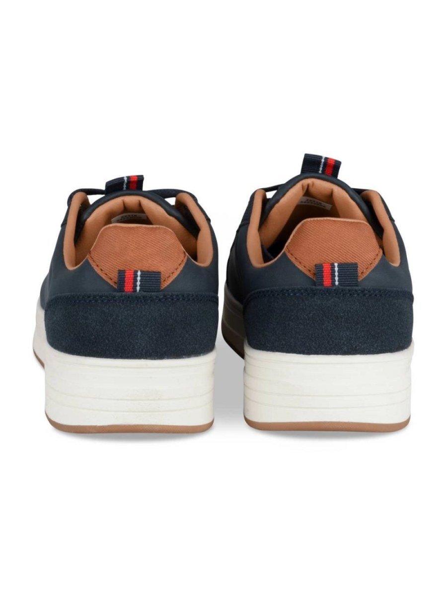 Navy perforated sneakers with tan collar