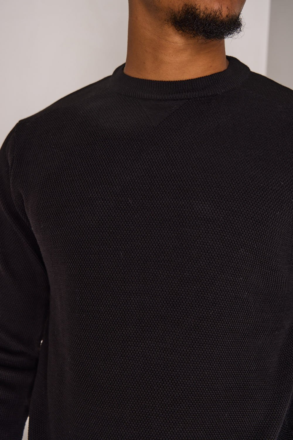 Black knit crew-neck jumper