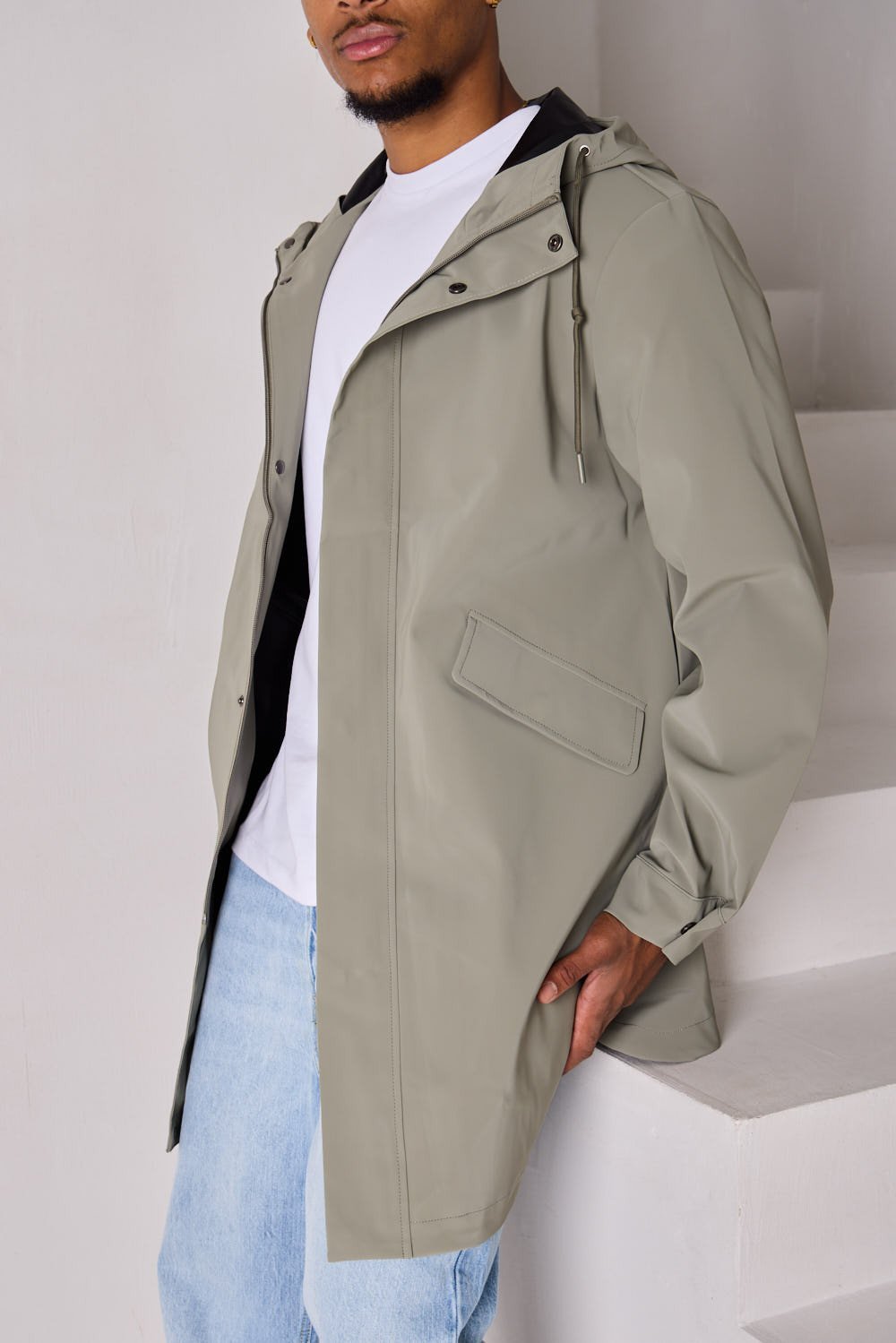 Green textured hooded rain jacket