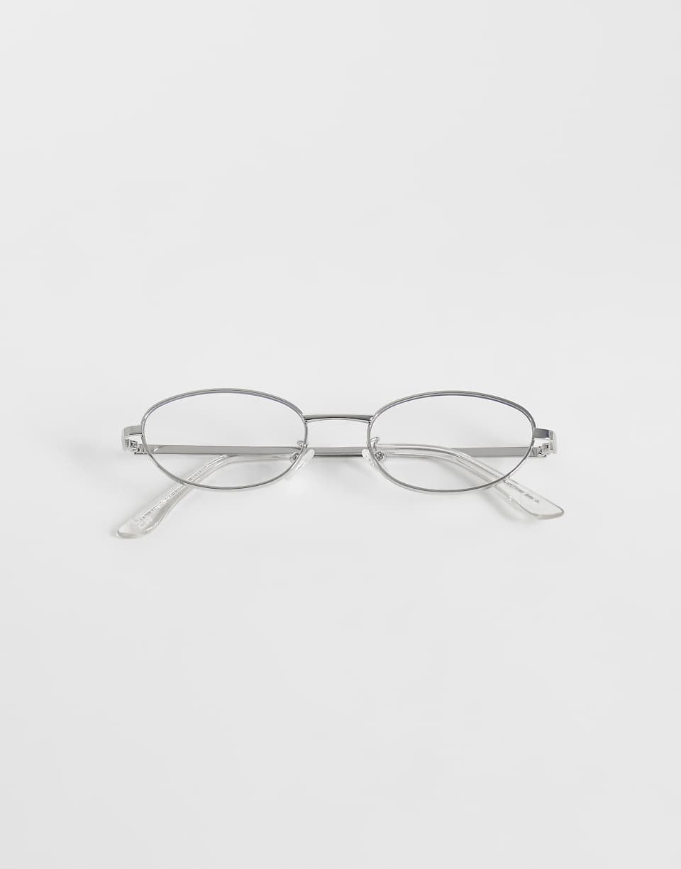 Lunettes de soleil à monture métallique argentée avec verres bleus transparents