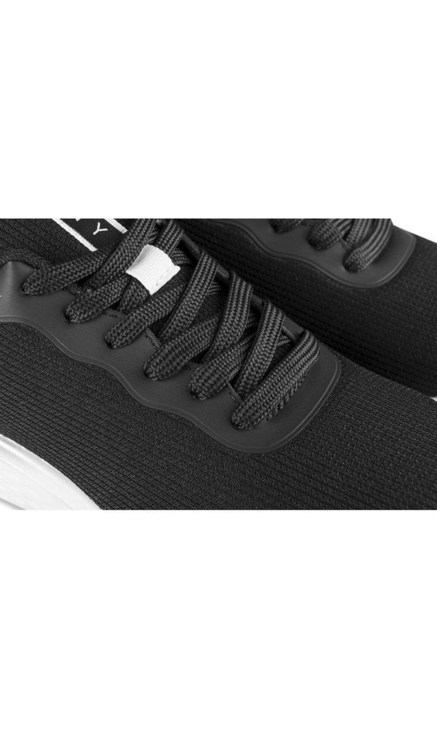 Black sneakers with silver sole trim
