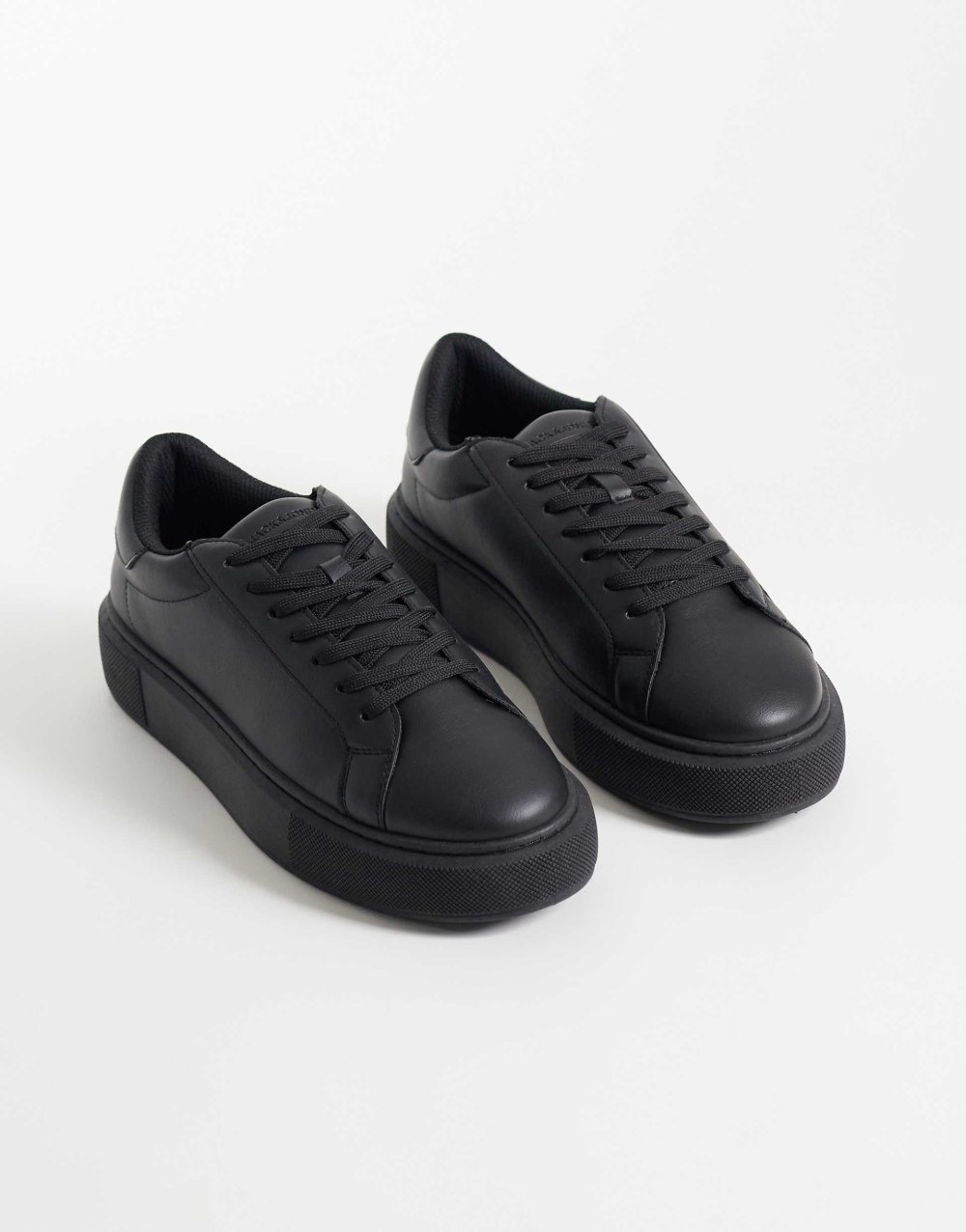 Baskets en similicuir noires