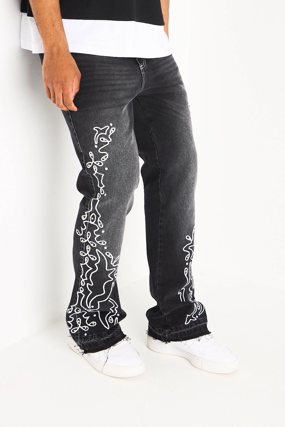 Black straight jeans with arabesque pattern