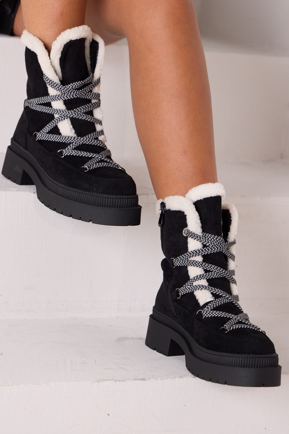 Black suede lace-up ankle boots with shearling