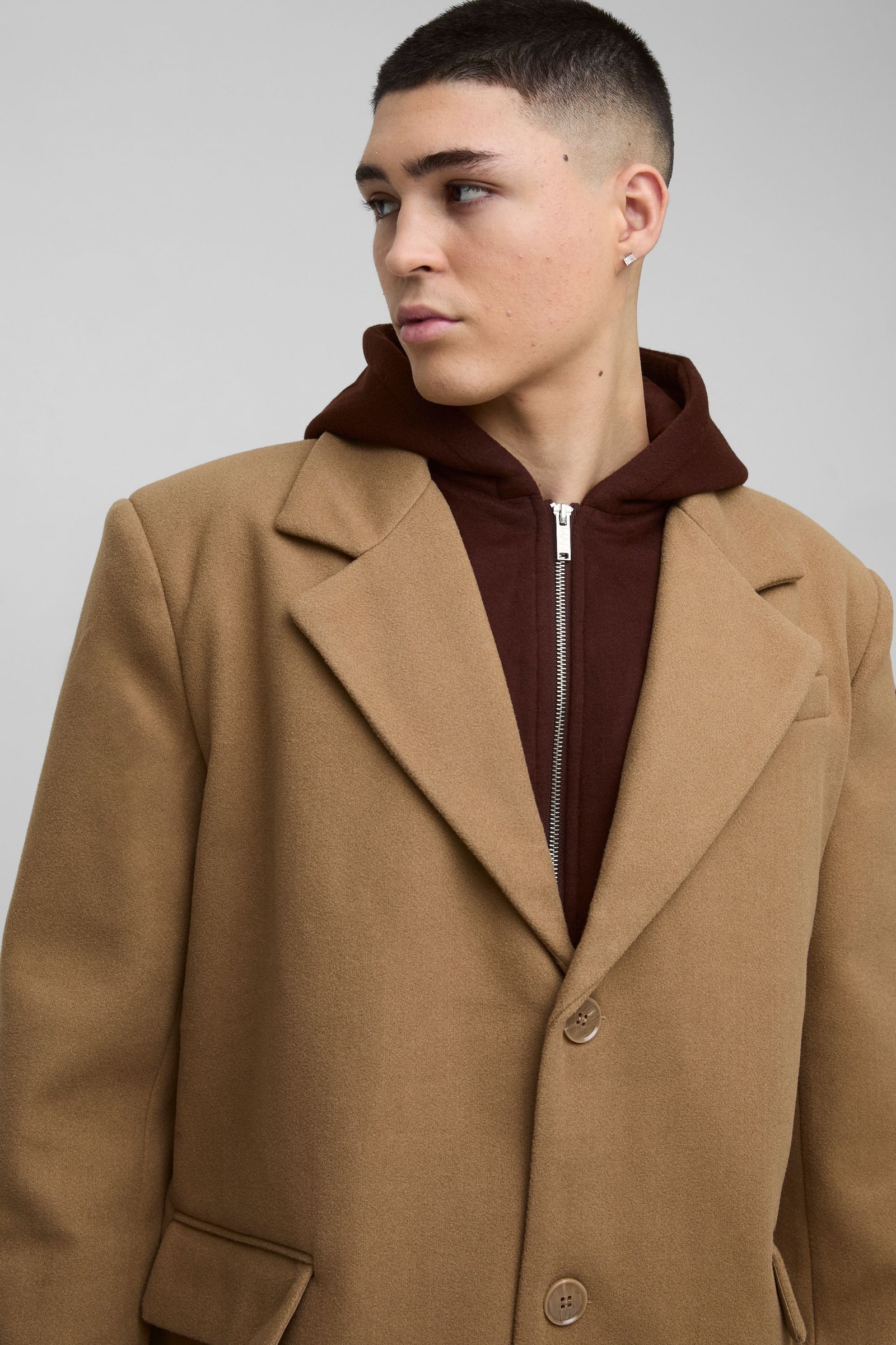 Oversized overcoat with faux hooded jersey layer in tan