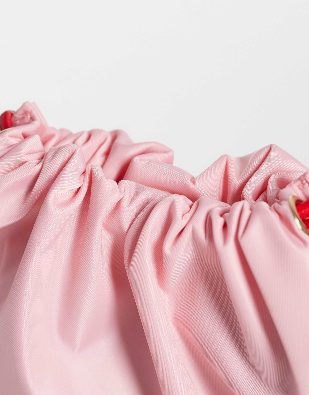 Pink drawstring clutch bag