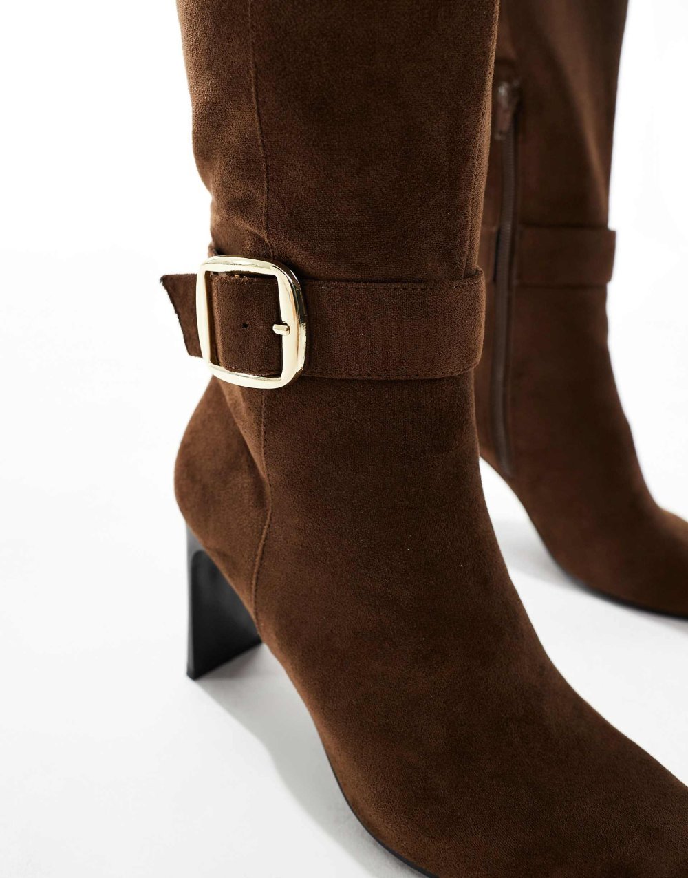 Knee high heeled boots with buckles in brown