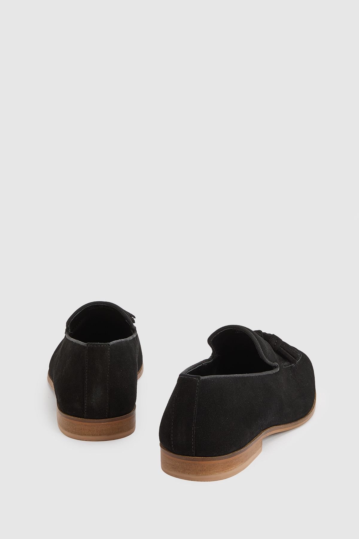 Mocassin à pompons en daim noir