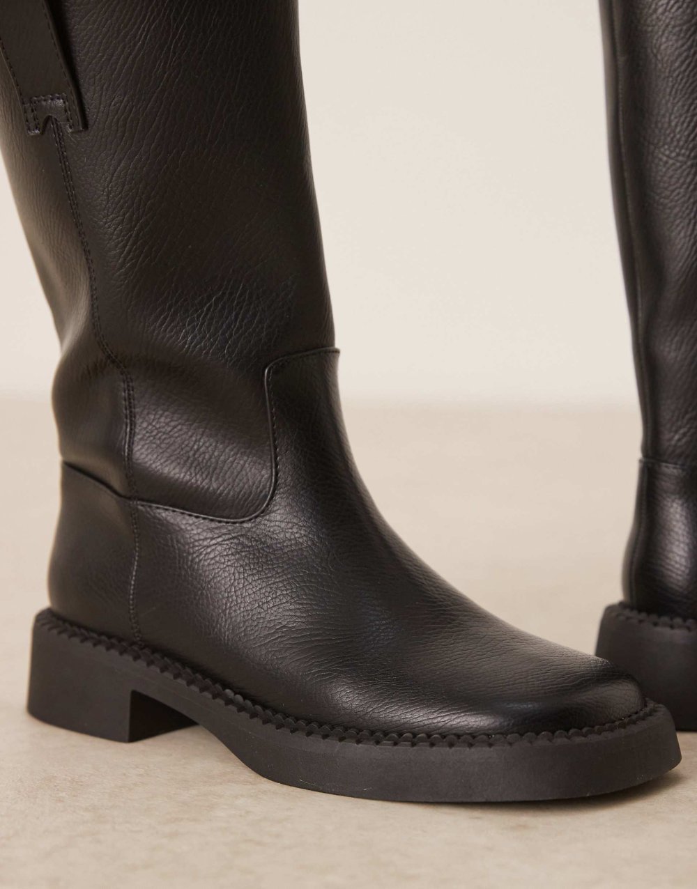 Flat knee high biker boots in black