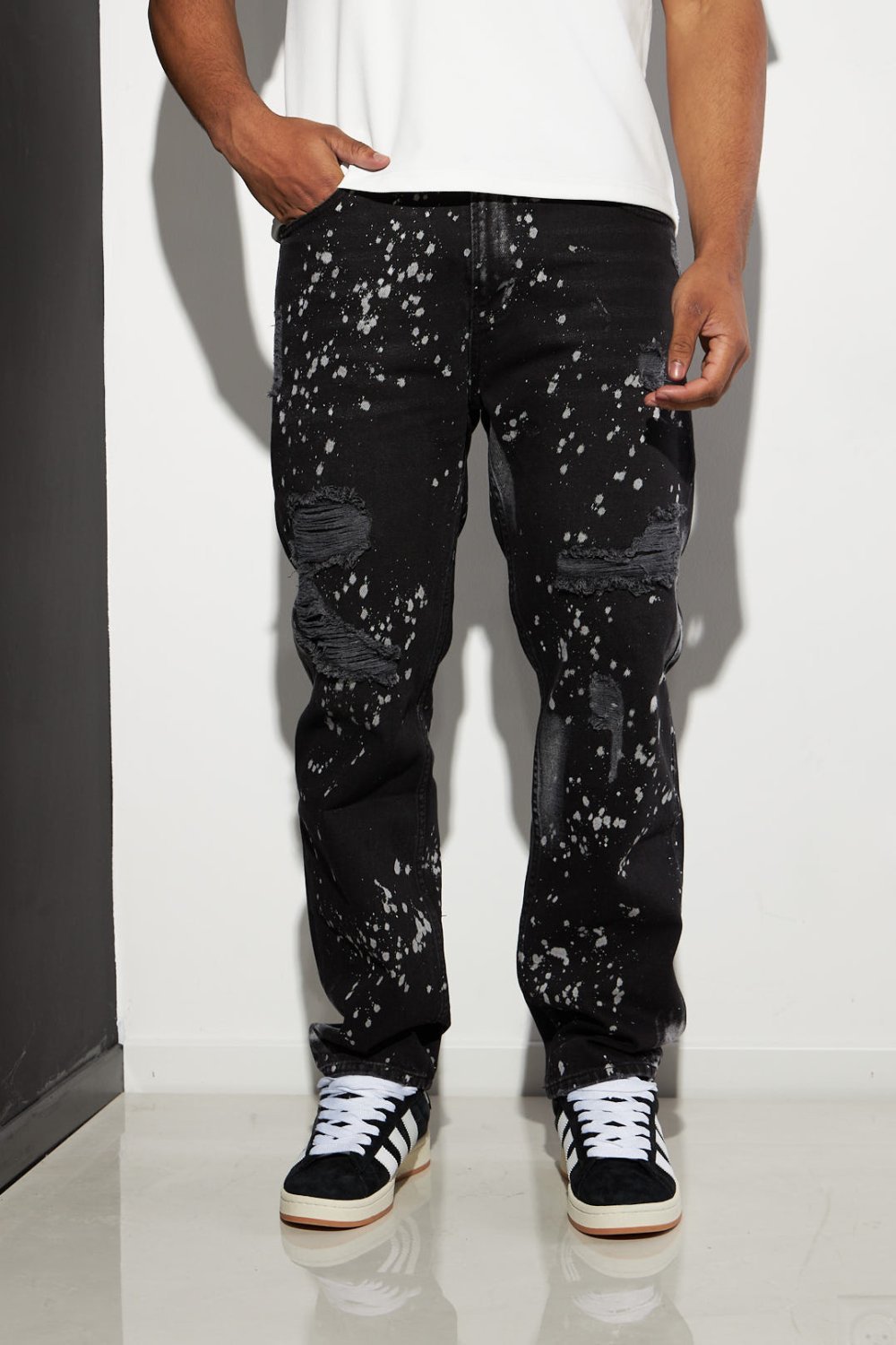 Black ripped jeans with paint splatter
