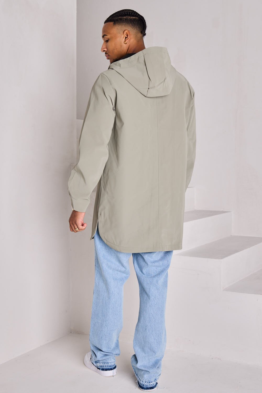 Green textured hooded rain jacket