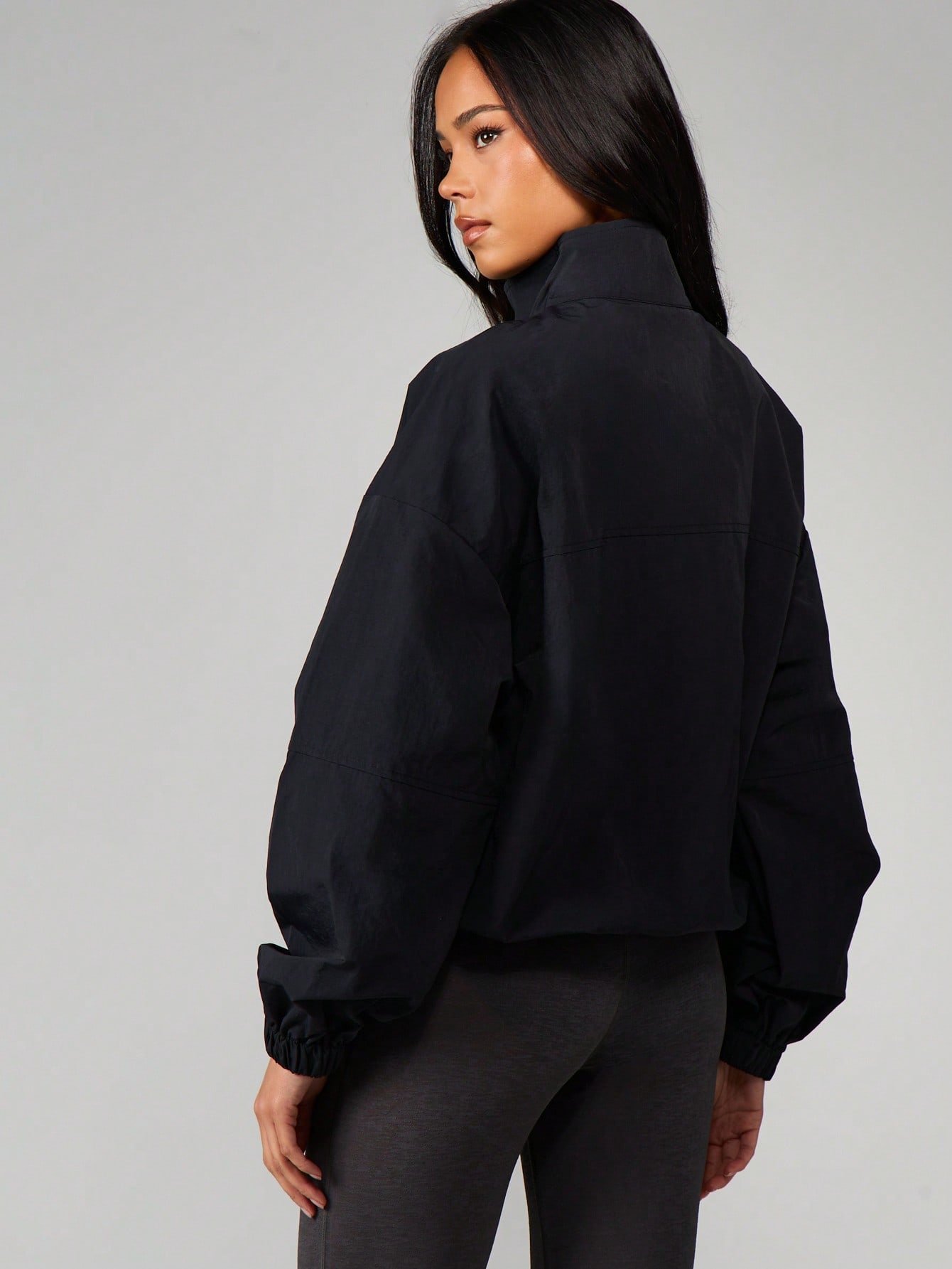 Veste coupe-vent col montant demi-zip