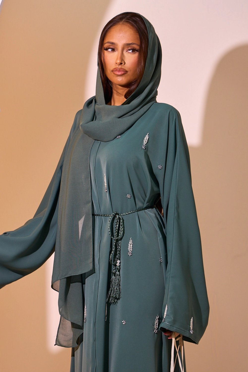 Dark green abaya with ear and floral rhinestones