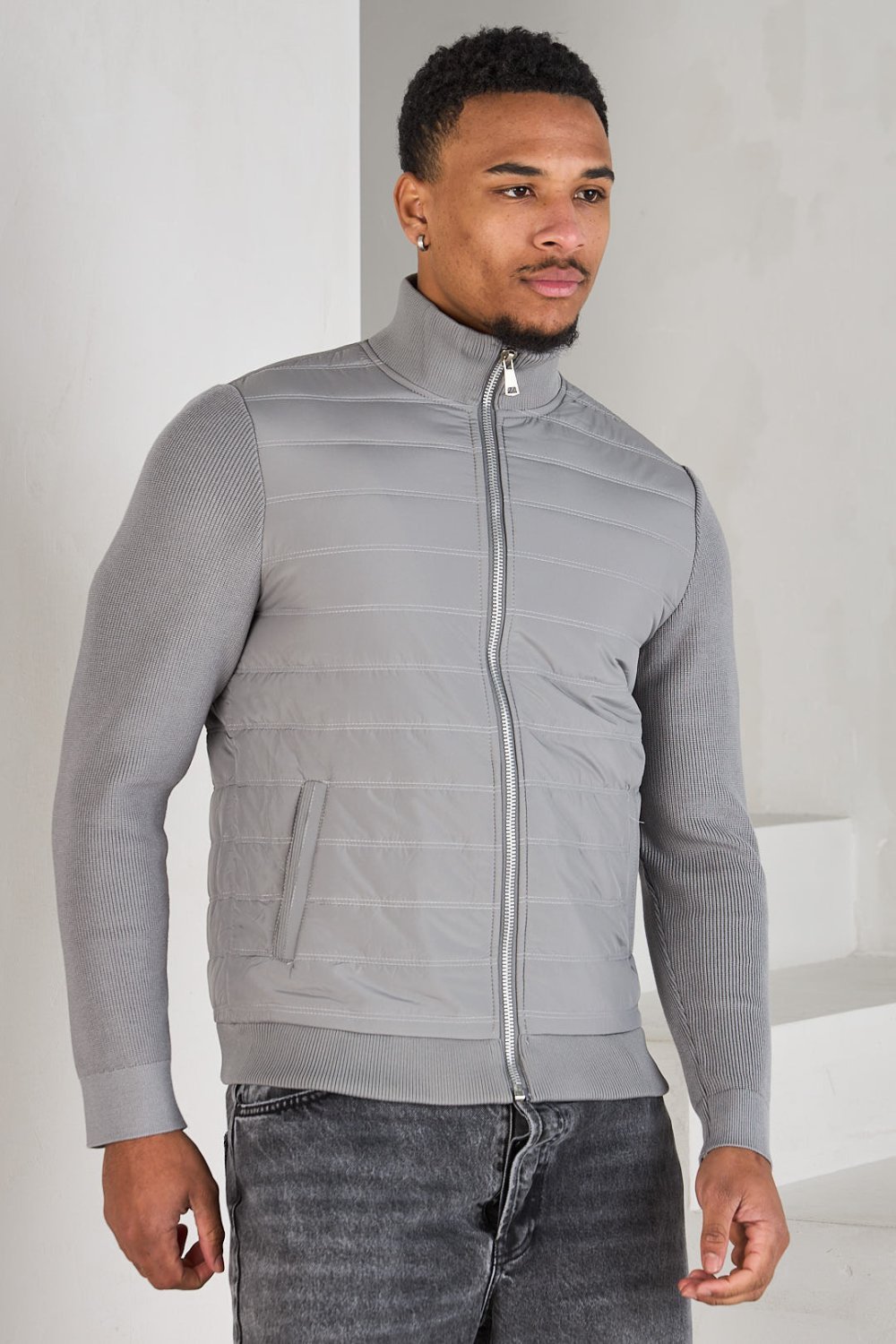 Dark grey quilted jacket with knit panel
