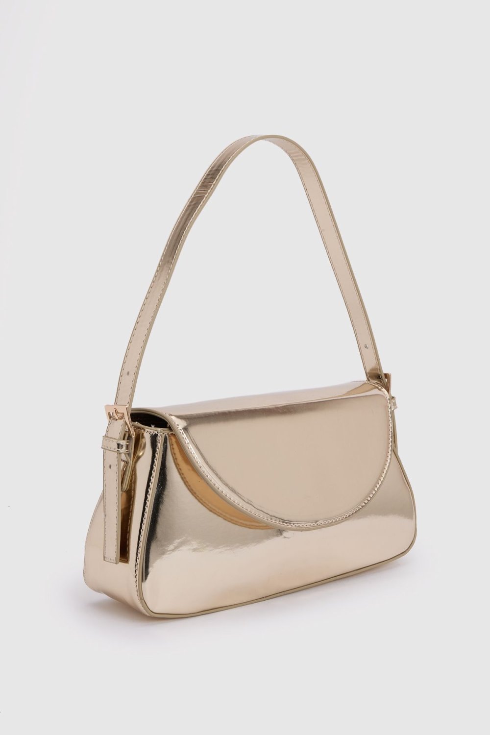Patent shoulder bag with fold-over flap
