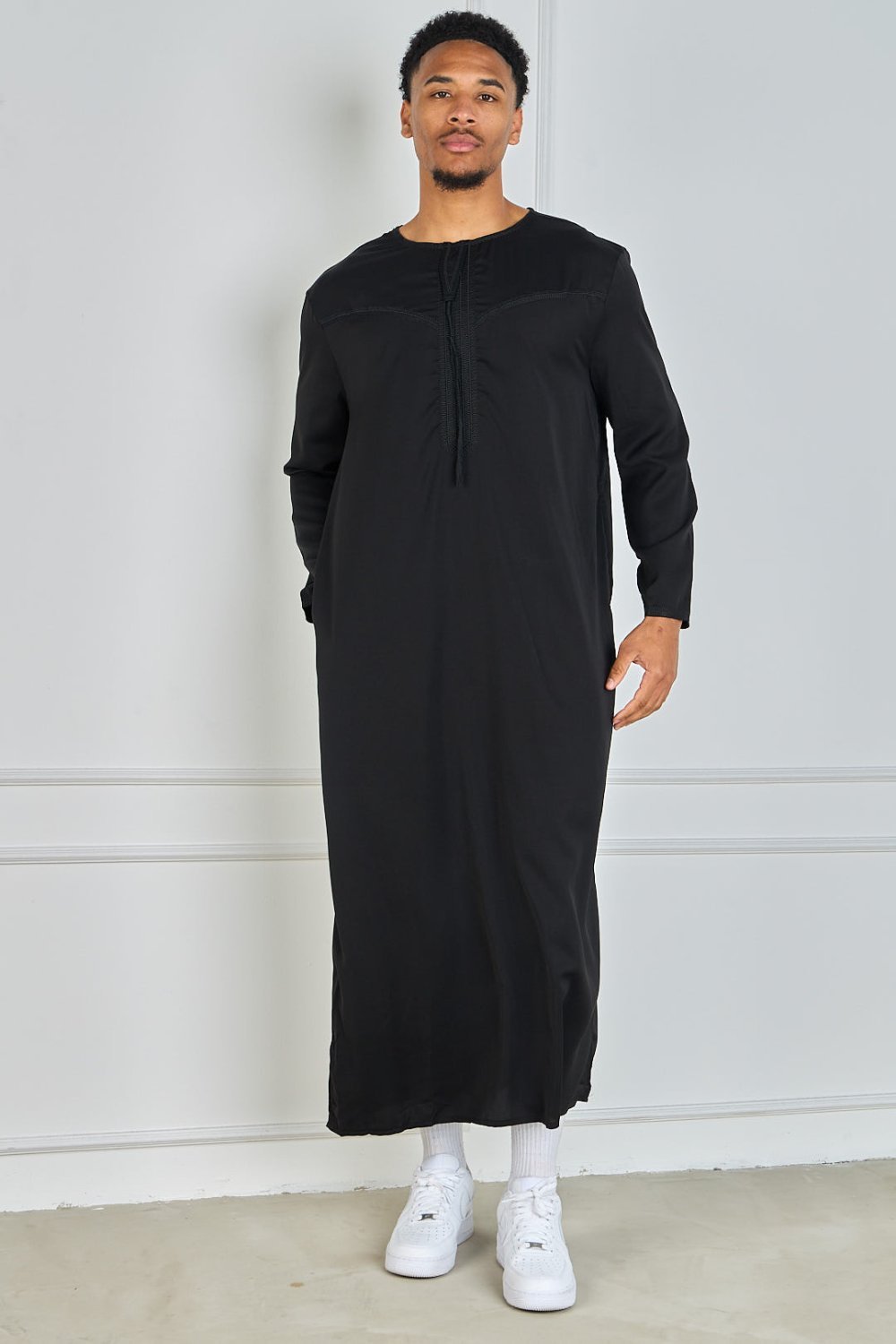 Black qamis with embroidered collar and tassel