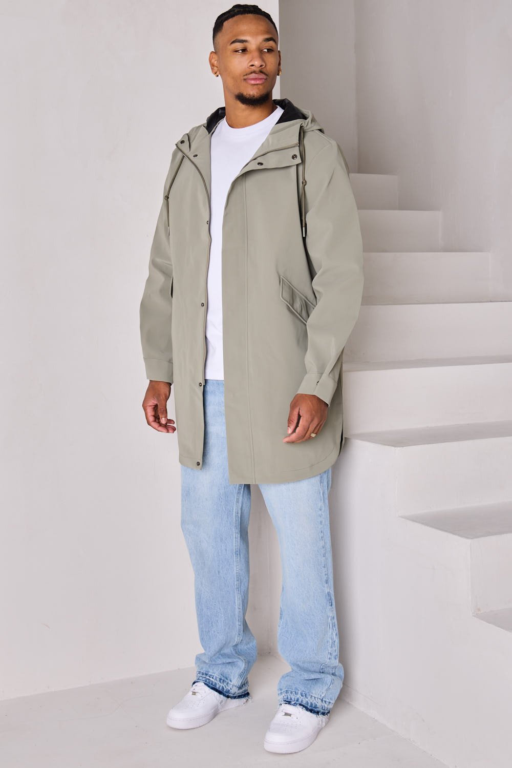 Green textured hooded rain jacket