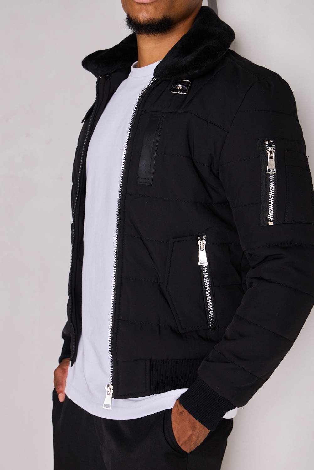 Black quilted jacket with fur collar