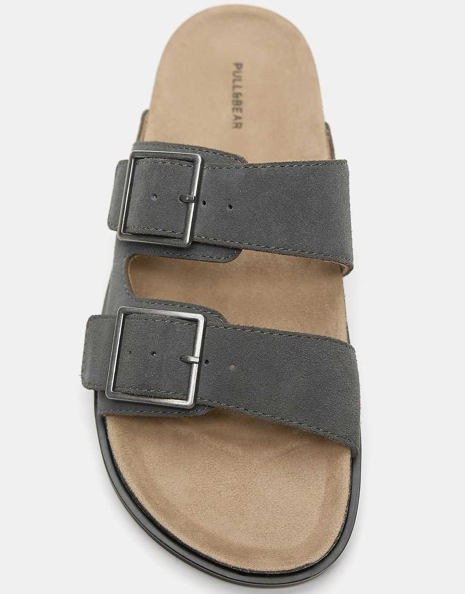 Leather flat buckle sandals in grey