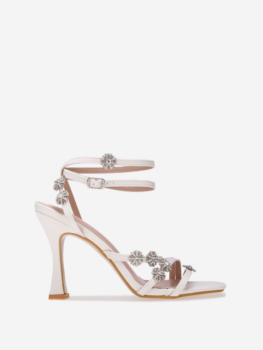 White spool heel sandals with star charms