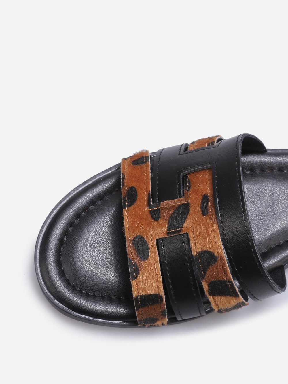 Black flat mules with interlocking straps