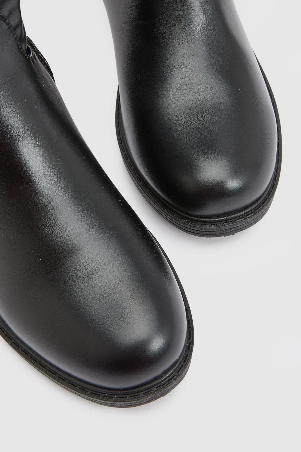 Black chunky knee-high boots