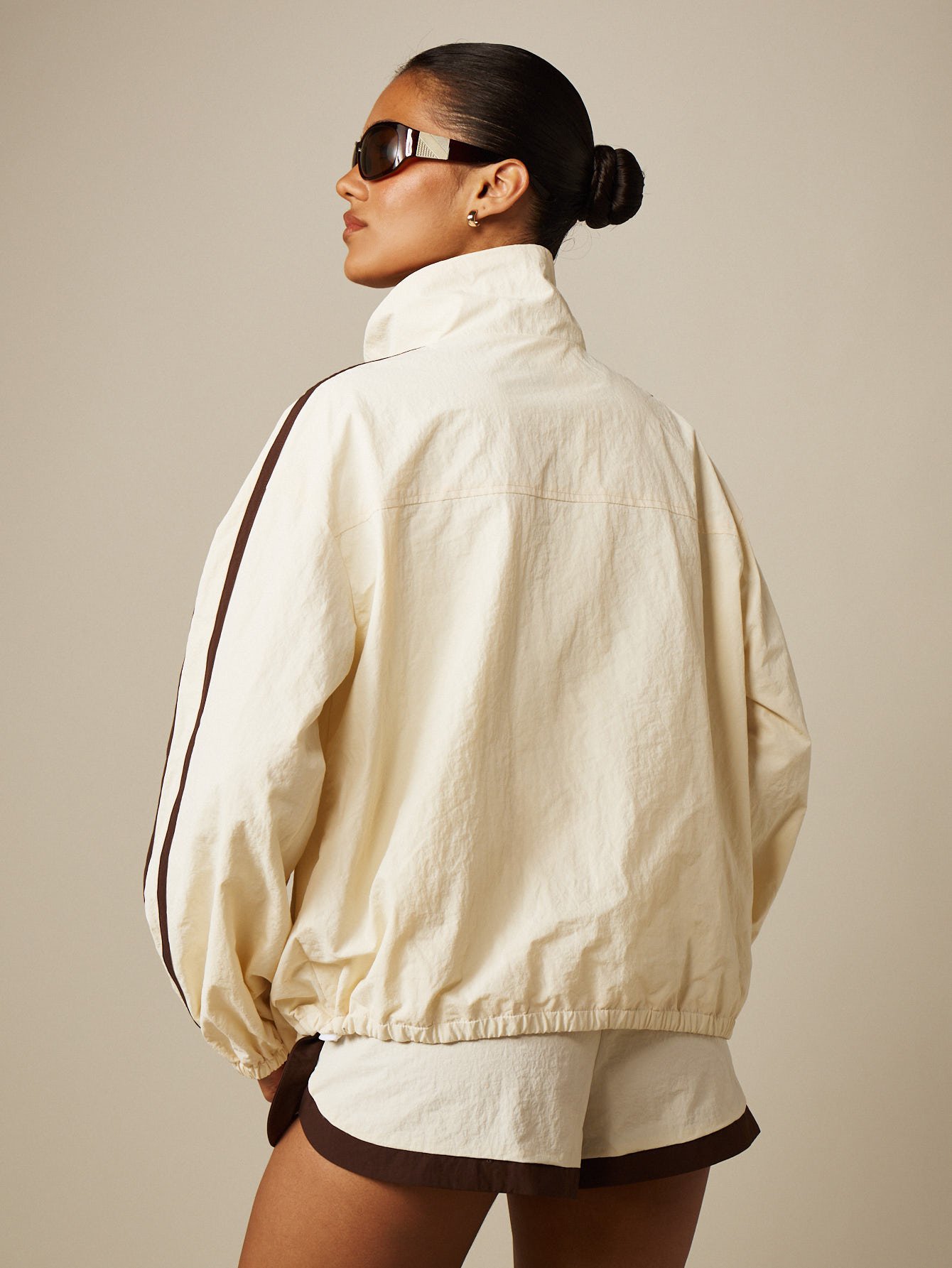 Nylon windbreaker jacket with contrast piping