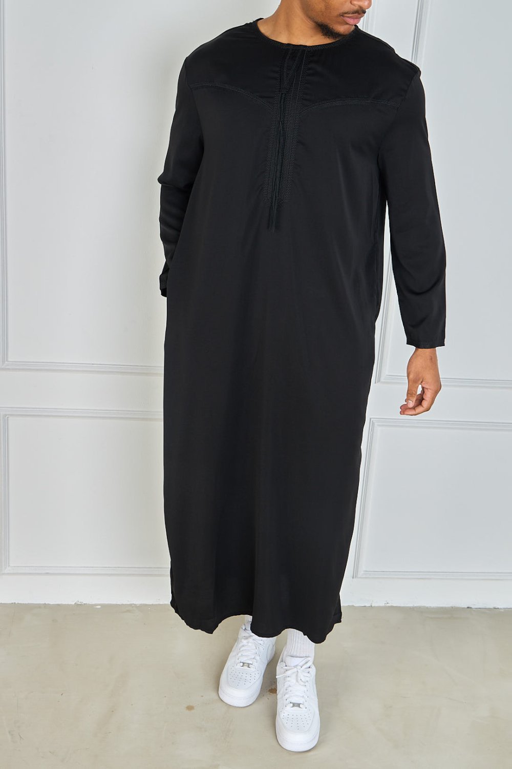 Black qamis with embroidered collar and tassel