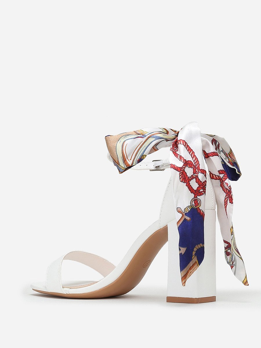 White block heel sandals with printed scarf