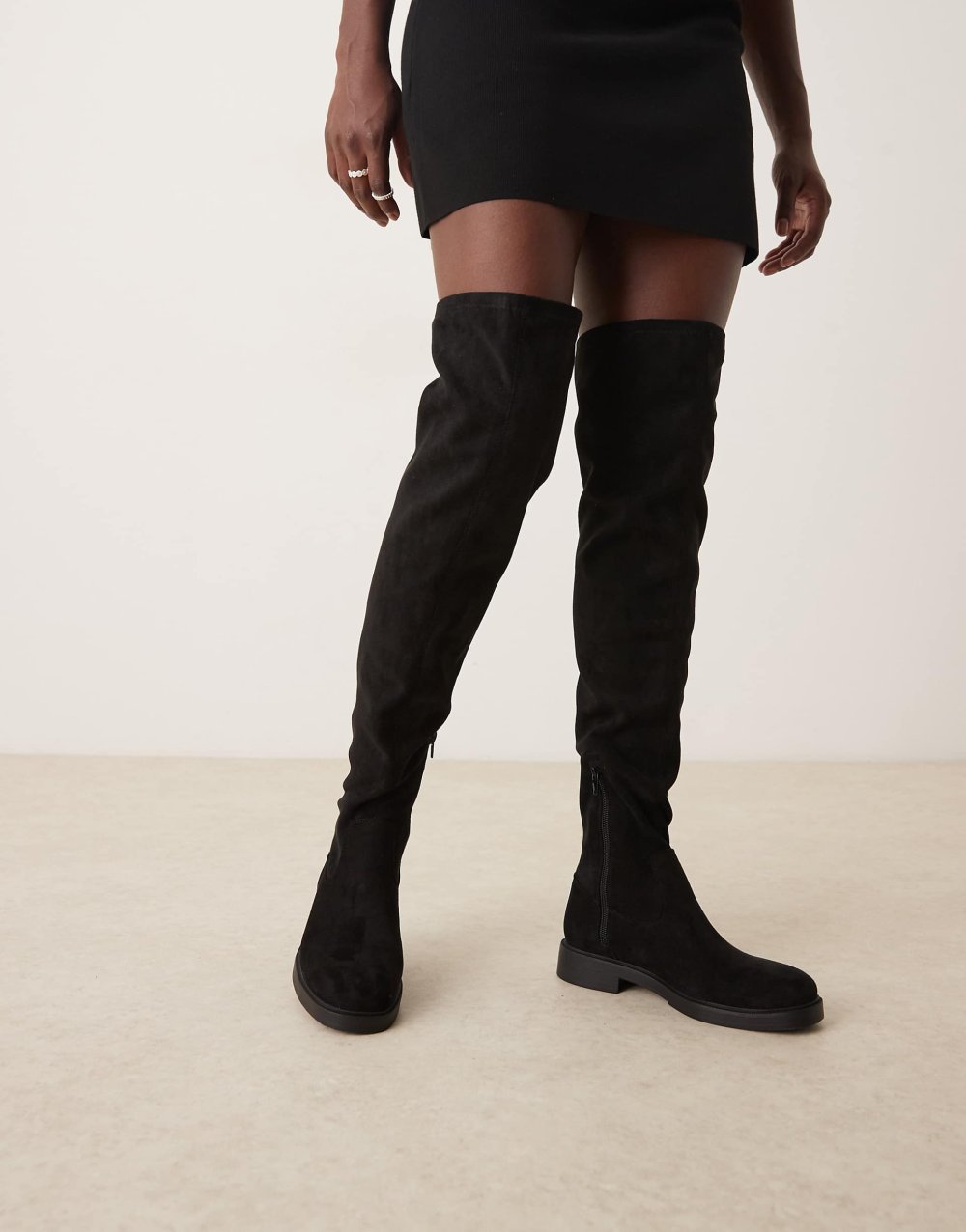 Flat faux suede thigh high boots in black