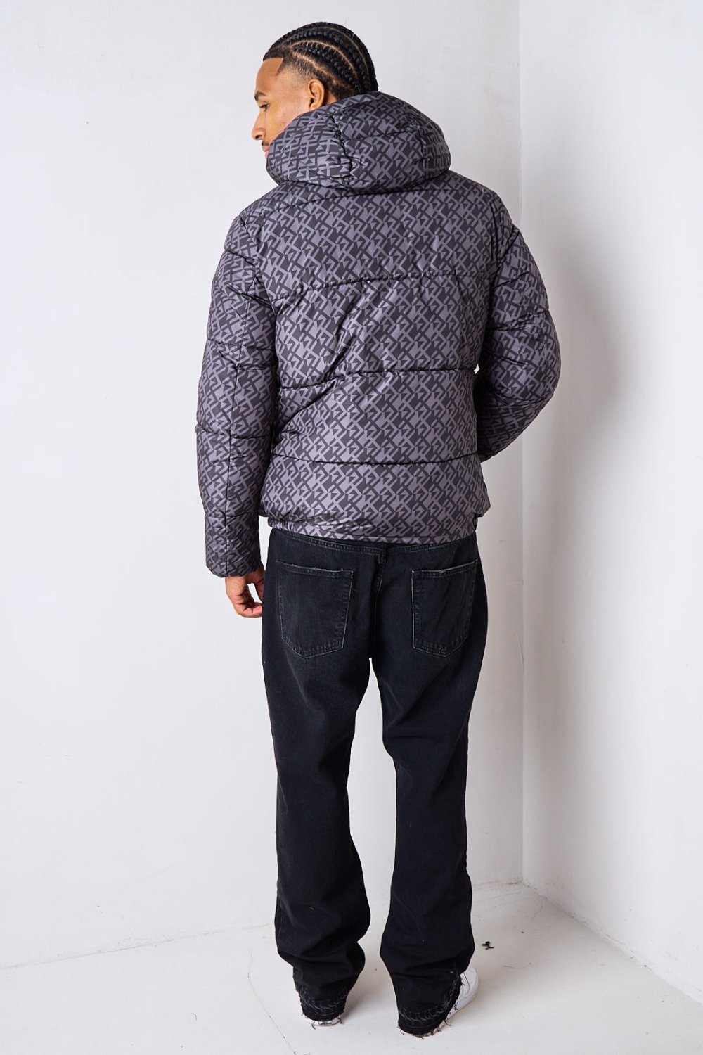 Black short puffer jacket with repeat pattern