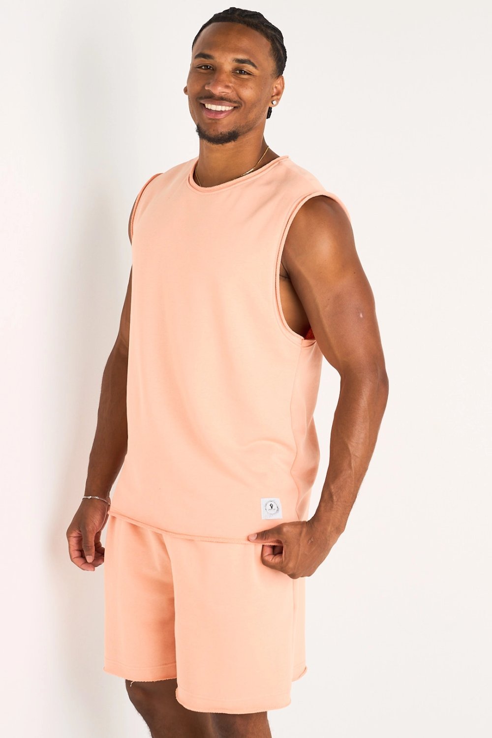 Ensemble t-shirt sans manches et short saumon